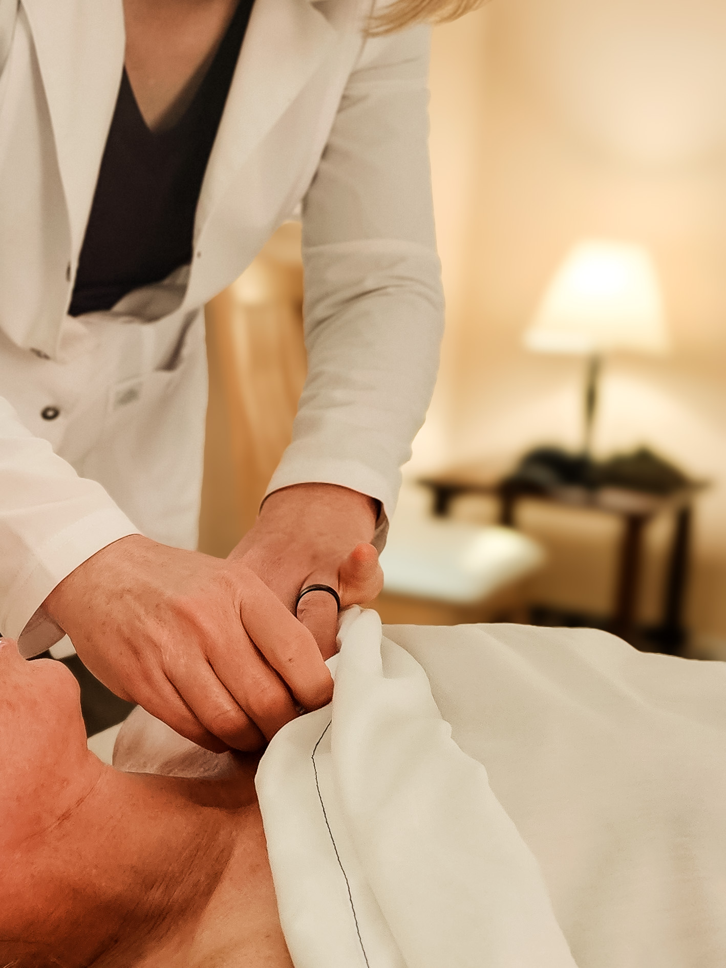 Jennifer Briggs performing acupuncture on a patient